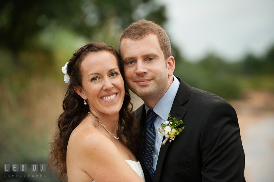 The happy expressions of the Bride and Groom after the wedding ceremony. Kent Island Maryland Chesapeake Bay Beach Club wedding photo, by wedding photographers of Leo Dj Photography. http://leodjphoto.com