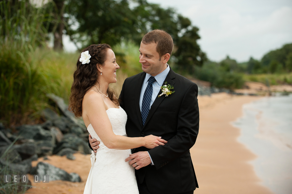 The radiant Bride and Groom by the beach. Kent Island Maryland Chesapeake Bay Beach Club wedding photo, by wedding photographers of Leo Dj Photography. http://leodjphoto.com