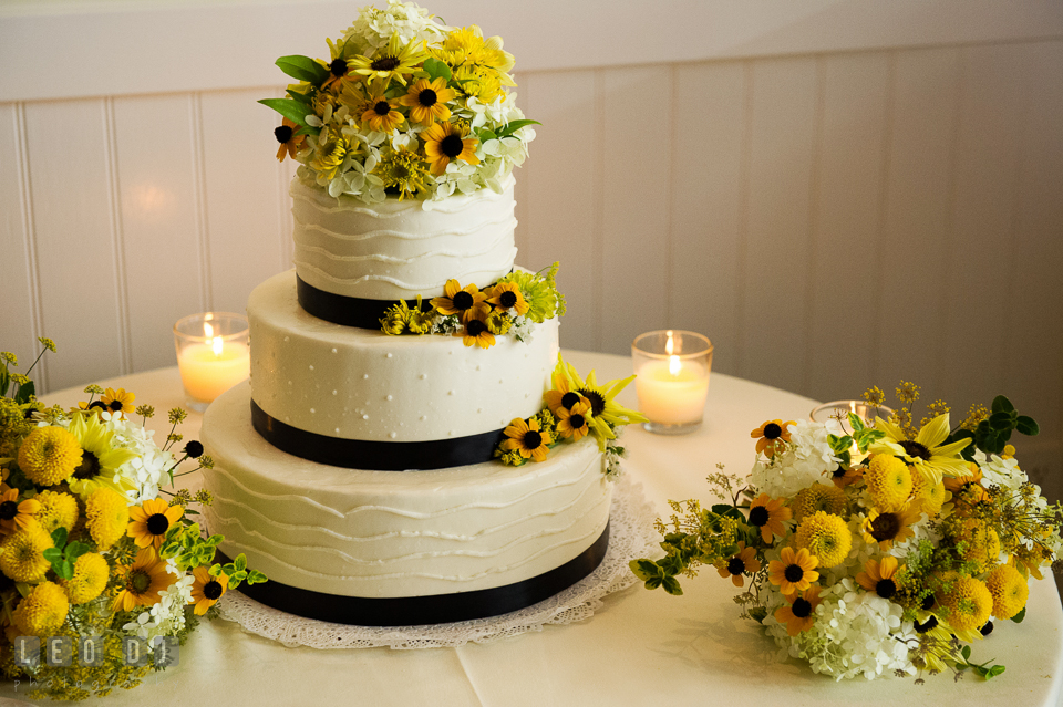 Wedding cake by Fiona's Cakes with flower decorations from Willow Oak Flower and Herb Garden. Kent Island Maryland Chesapeake Bay Beach Club wedding photo, by wedding photographers of Leo Dj Photography. http://leodjphoto.com