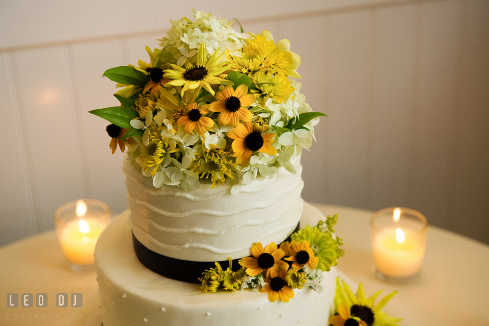 Summer blooms from Willow Oak Flower and Herb Garden serve as enchanting cake topper by Fiona's Cakes. Kent Island Maryland Chesapeake Bay Beach Club wedding photo, by wedding photographers of Leo Dj Photography. http://leodjphoto.com