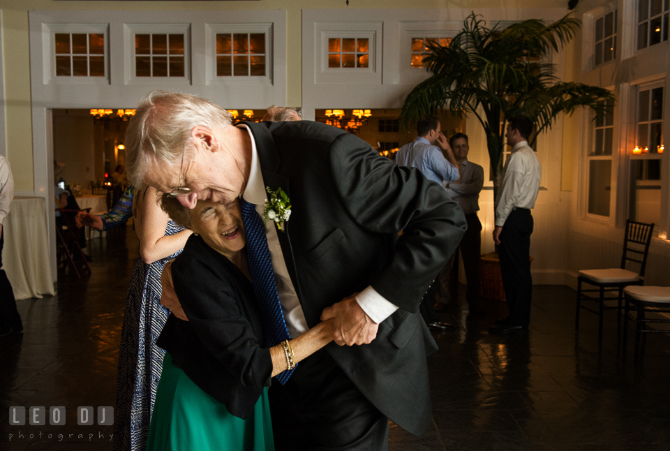 Father of the Groom and grandmother dancing and laughing together. Kent Island Maryland Chesapeake Bay Beach Club wedding photo, by wedding photographers of Leo Dj Photography. http://leodjphoto.com