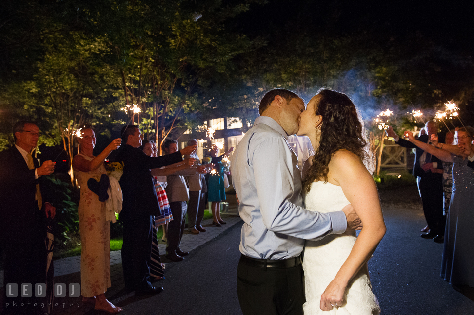 Sparklers and lined up guests to send off Bride and Groom in a grand exit. Kent Island Maryland Chesapeake Bay Beach Club wedding photo, by wedding photographers of Leo Dj Photography. http://leodjphoto.com