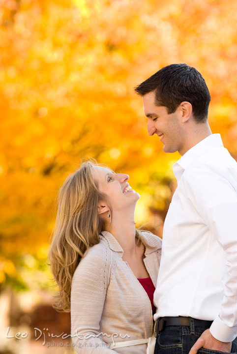 Engaged girl looking up at her fiance. Pre-wedding engagement photo session at Washington College and Chestertown, Maryland, by wedding photographer Leo Dj Photography.