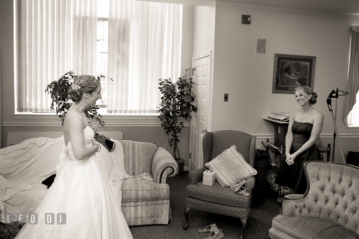 Bridesmaid amazed seeing Bride the first time in wedding dress. St Andrews United Methodist wedding photos at Annapolis, Eastern Shore, Maryland by photographers of Leo Dj Photography.