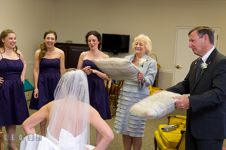 Mother and Father of Bride fan Bride to cool off. St Andrews United Methodist wedding photos at Annapolis, Eastern Shore, Maryland by photographers of Leo Dj Photography.