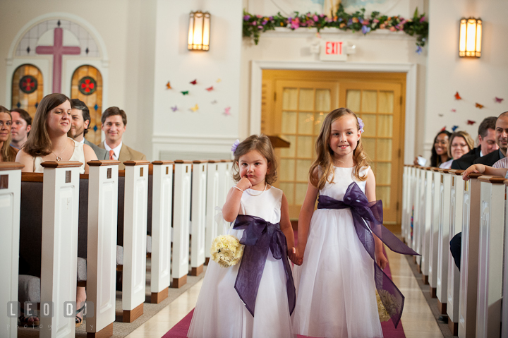 Flower girls walking down the isle. St Andrews United Methodist wedding photos at Annapolis, Eastern Shore, Maryland by photographers of Leo Dj Photography.