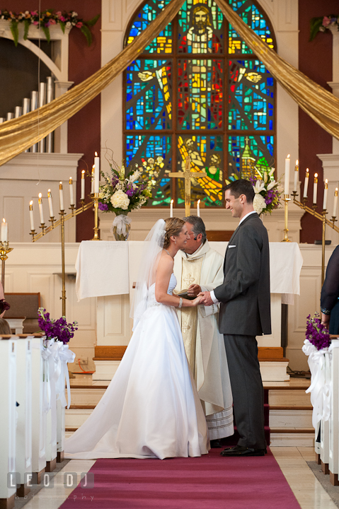 Bride and Groom holding hands and smiled together at the ceremony. St Andrews United Methodist wedding photos at Annapolis, Eastern Shore, Maryland by photographers of Leo Dj Photography.