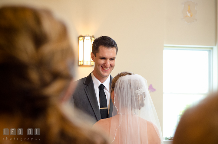 Groom smiled and recited his vows to the Bride. St Andrews United Methodist wedding photos at Annapolis, Eastern Shore, Maryland by photographers of Leo Dj Photography.