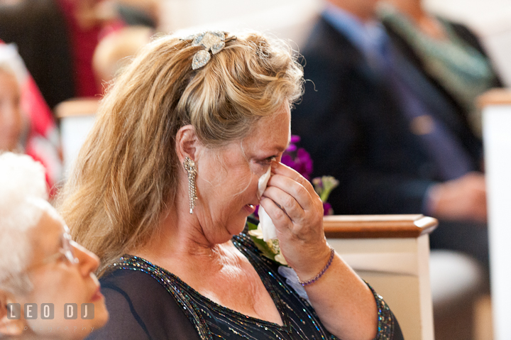 Mother of Groom shed tear during the ceremony. St Andrews United Methodist wedding photos at Annapolis, Eastern Shore, Maryland by photographers of Leo Dj Photography.