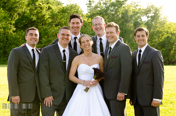 Bride photo group shot with Best Man and Groomsmen. St Andrews United Methodist wedding photos at Annapolis, Eastern Shore, Maryland by photographers of Leo Dj Photography.