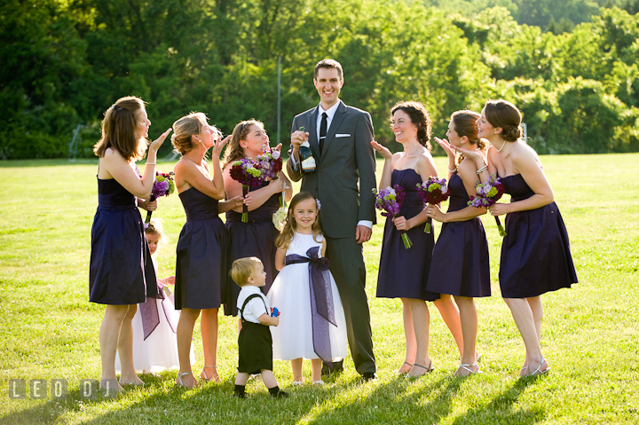 Groom photo group shot with Matron of Honor and Bridesmaids. St Andrews United Methodist wedding photos at Annapolis, Eastern Shore, Maryland by photographers of Leo Dj Photography.