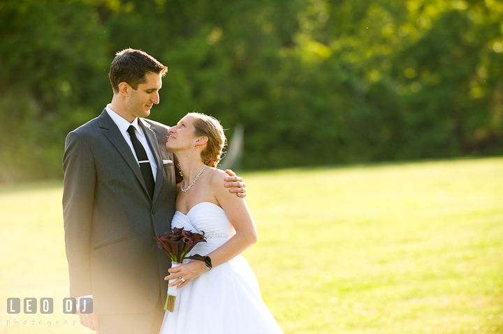 Bride and Groom cuddling. St Andrews United Methodist wedding photos at Annapolis, Eastern Shore, Maryland by photographers of Leo Dj Photography.