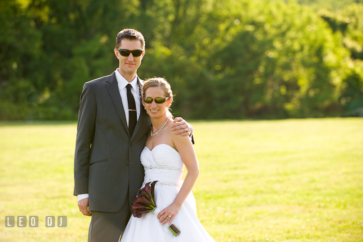 Bride and Groom wearing sunglasses. St Andrews United Methodist wedding photos at Annapolis, Eastern Shore, Maryland by photographers of Leo Dj Photography.