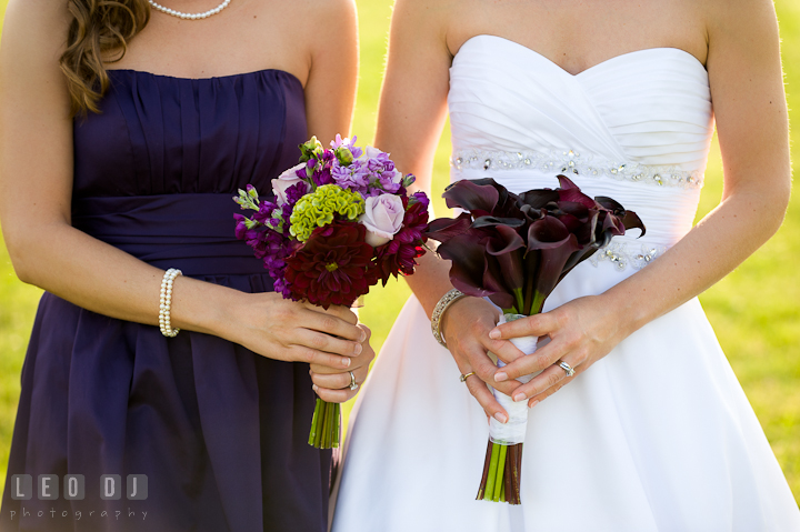 Bride and Bridesmaid showing their flower bouquets. St Andrews United Methodist wedding photos at Annapolis, Eastern Shore, Maryland by photographers of Leo Dj Photography.