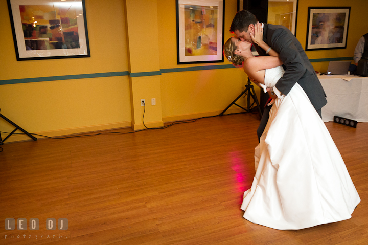 Bride and Groom doing the dip after their first dance. Yellowfin Restaurant wedding reception photos at Annapolis, Eastern Shore, Maryland by photographers of Leo Dj Photography.