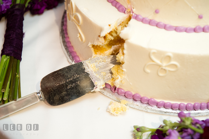 Heirloom cake server from Bride's parent. Yellowfin Restaurant wedding reception photos at Annapolis, Eastern Shore, Maryland by photographers of Leo Dj Photography.