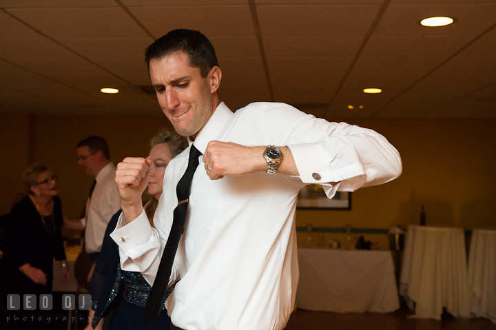 Groom dancing. Yellowfin Restaurant wedding reception photos at Annapolis, Eastern Shore, Maryland by photographers of Leo Dj Photography.
