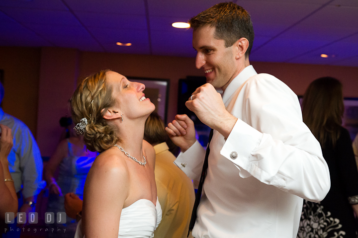 Bride and Groom having fun and dancing the night away. Yellowfin Restaurant wedding reception photos at Annapolis, Eastern Shore, Maryland by photographers of Leo Dj Photography.
