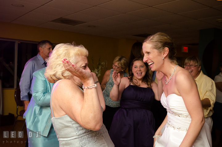 Mother of Bride dancing with her daughter. Yellowfin Restaurant wedding reception photos at Annapolis, Eastern Shore, Maryland by photographers of Leo Dj Photography.