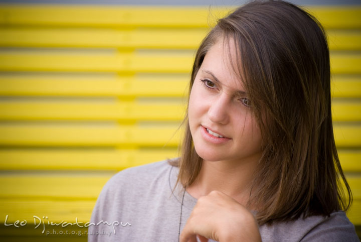 Headshot of girl with yellow background. Eastern Shore, Maryland, Kent Island High School senior portrait session by photographer Leo Dj Photography.
