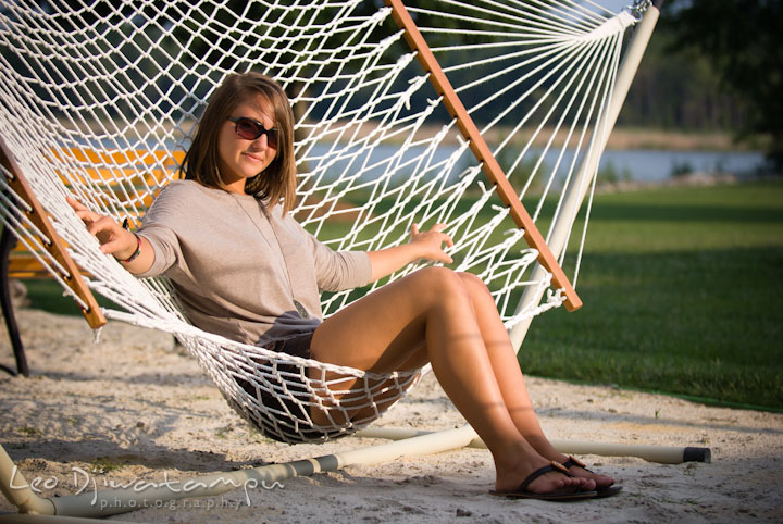 Girl lounging on hammock. Eastern Shore, Maryland, Kent Island High School senior portrait session by photographer Leo Dj Photography.