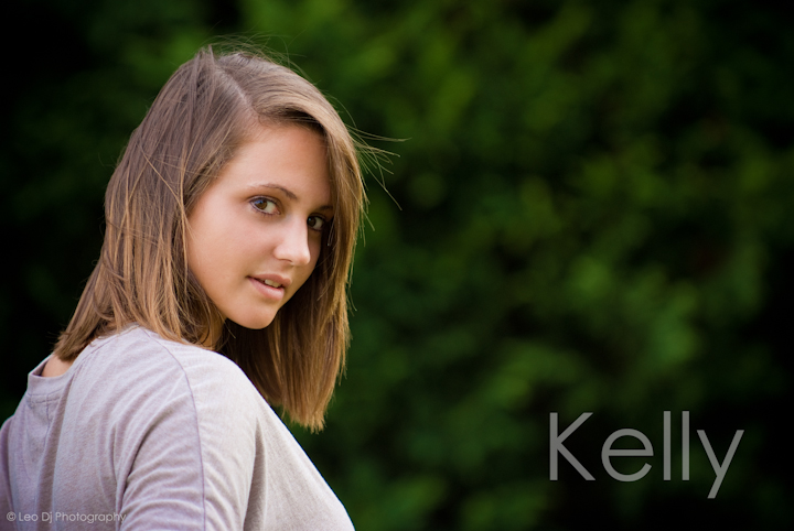 Girl looking over shoulder. Eastern Shore, Maryland, Kent Island High School senior portrait session by photographer Leo Dj Photography.