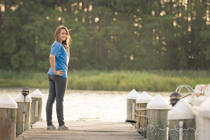 Girl posing on a boat pier at sunset. Eastern Shore, Maryland, Kent Island High School senior portrait session by photographer Leo Dj Photography.