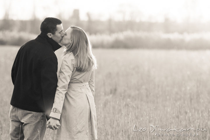 Engaged guy kissing his fiancée in a meadow. Chestertown Maryland and Washington College Pre-Wedding Engagement Session Photographer, Leo Dj Photography