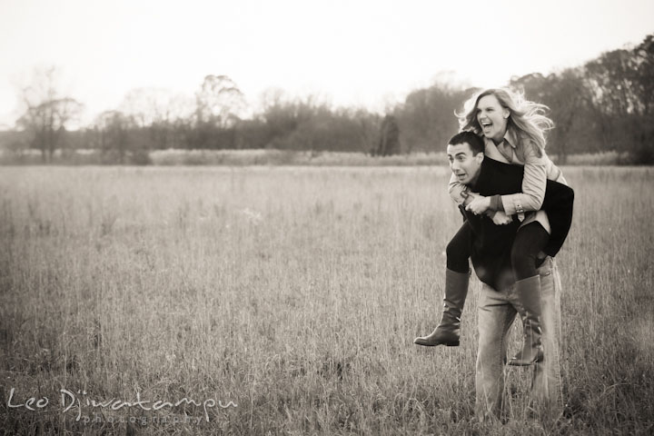 Engaged couple in a grass field goofing around. Chestertown Maryland and Washington College Pre-Wedding Engagement Session Photographer, Leo Dj Photography