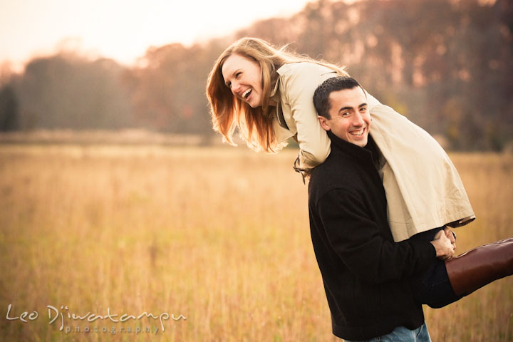 Engaged guy carried his fiancée on his shoulder. Chestertown Maryland and Washington College Pre-Wedding Engagement Session Photographer, Leo Dj Photography