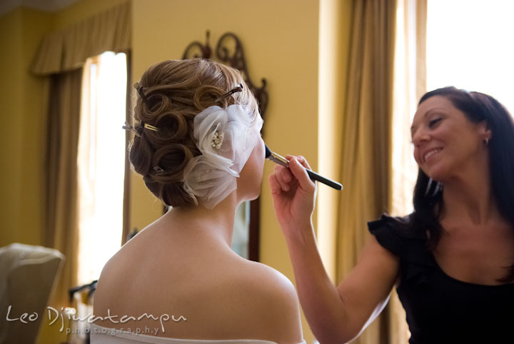 Make up artist from Angela Papa's, Behind the Veil putting make up on bride. The Tidewater Inn Wedding, Easton Maryland, getting ready photo coverage of Kelsey and Jonnie by wedding photographers of Leo Dj Photography.