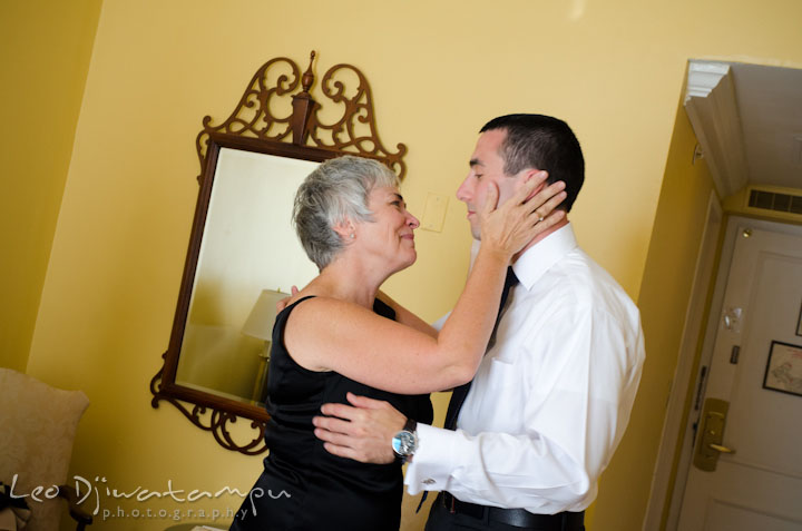 Mother of the groom holding her son with proud and joy. The Tidewater Inn Wedding, Easton Maryland, getting ready photo coverage of Kelsey and Jonnie by wedding photographers of Leo Dj Photography.