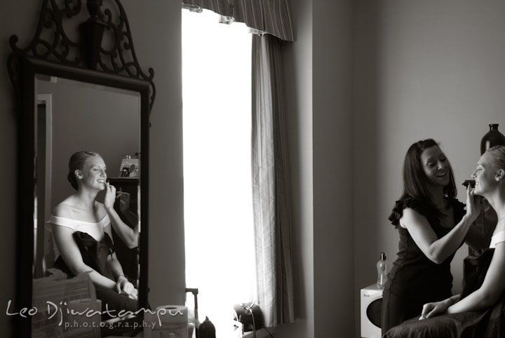 Bride's reflection on mirror while getting make up. The Tidewater Inn Wedding, Easton Maryland, getting ready photo coverage of Kelsey and Jonnie by wedding photographers of Leo Dj Photography.