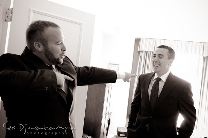 Groom goofing around with best man. The Tidewater Inn Wedding, Easton Maryland, getting ready photo coverage of Kelsey and Jonnie by wedding photographers of Leo Dj Photography.