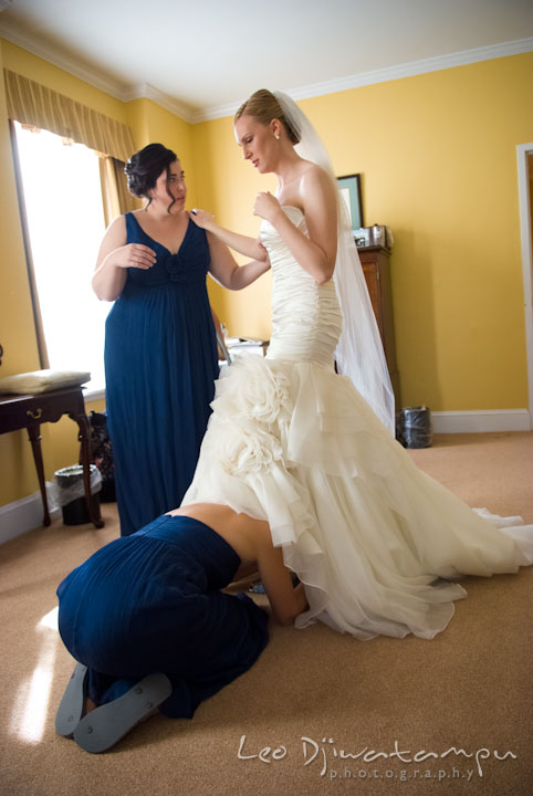 Matron of honor help bride put on shoes. The Tidewater Inn Wedding, Easton Maryland, getting ready photo coverage of Kelsey and Jonnie by wedding photographers of Leo Dj Photography.