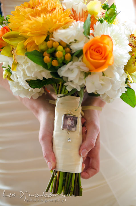 Locket on flower bouquet with photo of bride and her late father. The Tidewater Inn Wedding, Easton Maryland, getting ready photo coverage of Kelsey and Jonnie by wedding photographers of Leo Dj Photography.