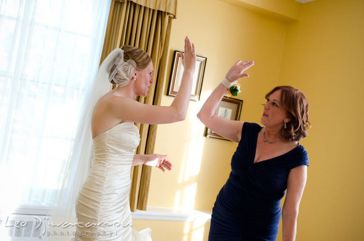 Bride giving high five to her mother. The Tidewater Inn Wedding, Easton Maryland, getting ready photo coverage of Kelsey and Jonnie by wedding photographers of Leo Dj Photography.