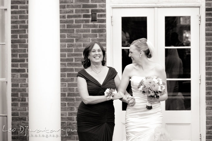 Bride walk down the isle escorted by mother. The Tidewater Inn Wedding, Easton Maryland, ceremony photo coverage of Kelsey and Jonnie by wedding photographers of Leo Dj Photography.