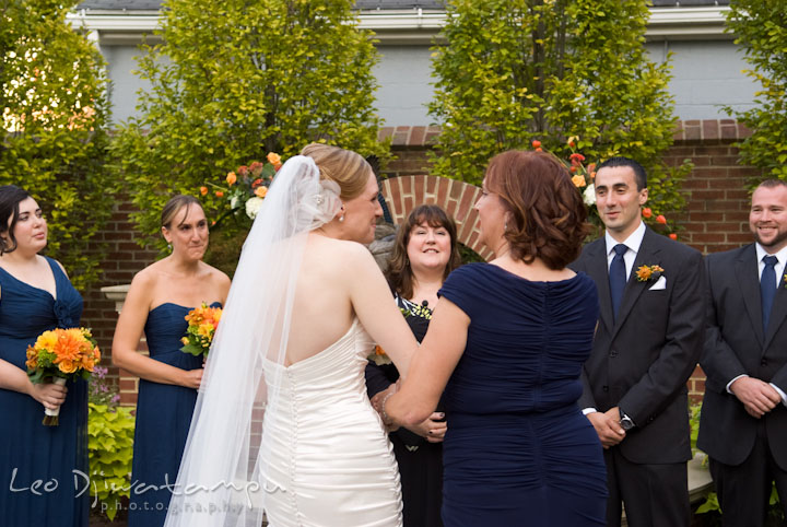 Mother handing over bride to groom. The Tidewater Inn Wedding, Easton Maryland, ceremony photo coverage of Kelsey and Jonnie by wedding photographers of Leo Dj Photography.