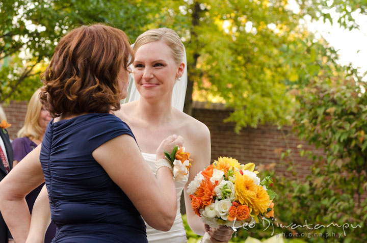 Mother wants to hug bride. The Tidewater Inn Wedding, Easton Maryland, ceremony photo coverage of Kelsey and Jonnie by wedding photographers of Leo Dj Photography.