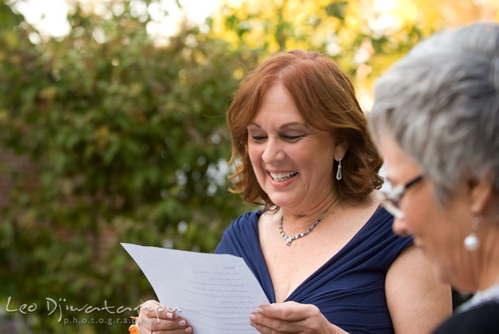 Mother of bride reading letter to bride and groom. The Tidewater Inn Wedding, Easton Maryland, ceremony photo coverage of Kelsey and Jonnie by wedding photographers of Leo Dj Photography.