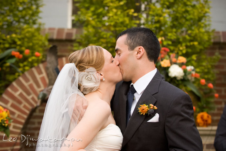 Bride and groom kissed each other. The Tidewater Inn Wedding, Easton Maryland, ceremony photo coverage of Kelsey and Jonnie by wedding photographers of Leo Dj Photography.