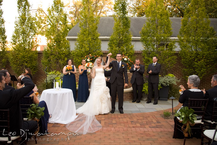 Officiant, introduced the married couple for the first time. The Tidewater Inn Wedding, Easton Maryland, ceremony photo coverage of Kelsey and Jonnie by wedding photographers of Leo Dj Photography.