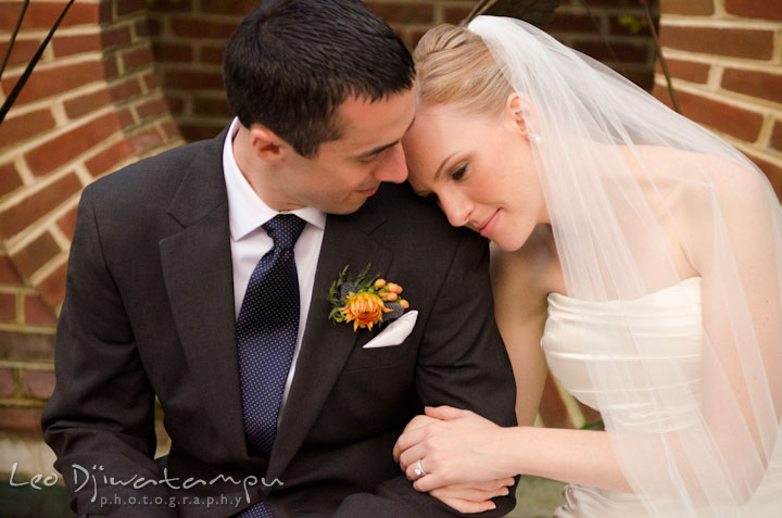 Bride leaning her head on groom's shoulder. The Tidewater Inn Wedding, Easton Maryland, ceremony photo coverage of Kelsey and Jonnie by wedding photographers of Leo Dj Photography.