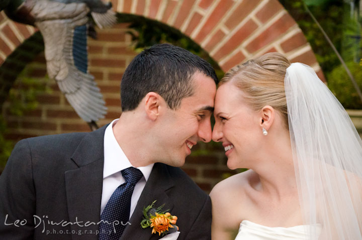 Bride and groom smiling together. The Tidewater Inn Wedding, Easton Maryland, ceremony photo coverage of Kelsey and Jonnie by wedding photographers of Leo Dj Photography.