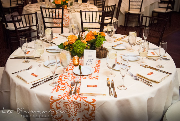 Table setting with the flower center piece. The Tidewater Inn Wedding, Easton Maryland, reception photo coverage of Kelsey and Jonnie by wedding photographers of Leo Dj Photography.