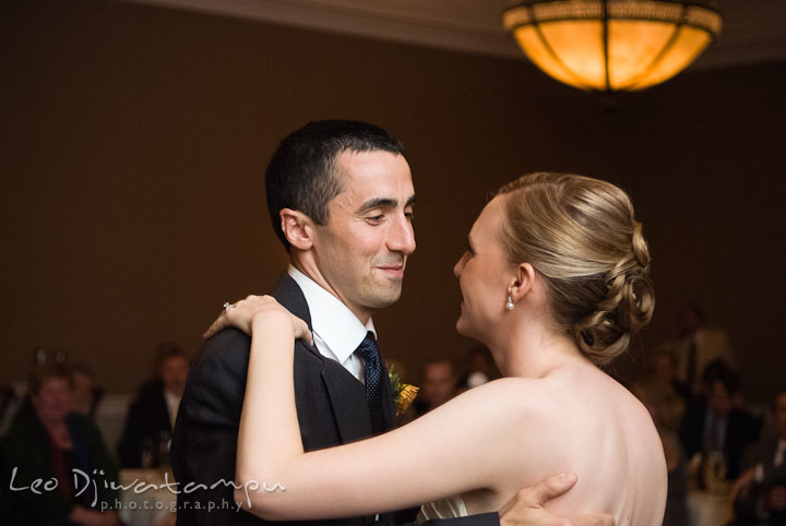 Groom smiling at bride during first dance. The Tidewater Inn Wedding, Easton Maryland, reception photo coverage of Kelsey and Jonnie by wedding photographers of Leo Dj Photography.