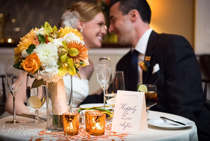 Bride groom smiling at sweetheart table. The Tidewater Inn Wedding, Easton Maryland, reception photo coverage of Kelsey and Jonnie by wedding photographers of Leo Dj Photography.