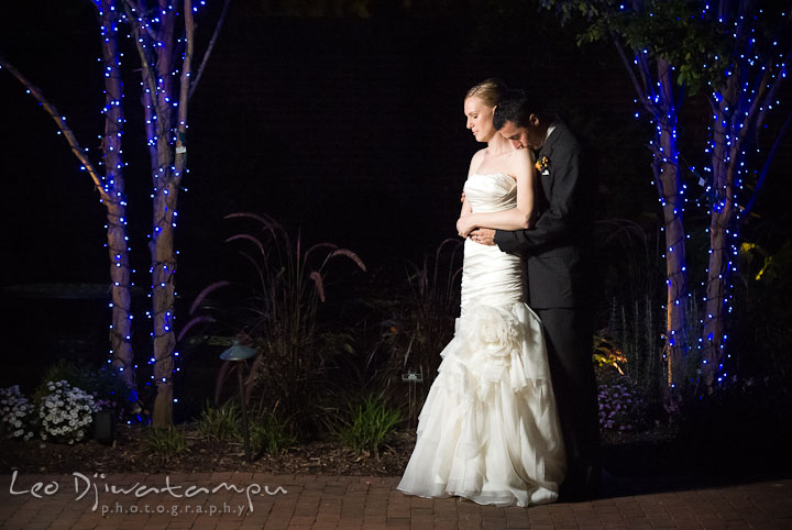 Groom kissed bride's shoulder. The Tidewater Inn Wedding, Easton Maryland, reception photo coverage of Kelsey and Jonnie by wedding photographers of Leo Dj Photography.