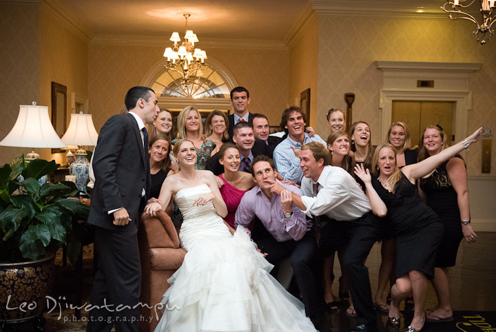 Groups shot with goofy gestures and funny expressions. The Tidewater Inn Wedding, Easton Maryland, reception photo coverage of Kelsey and Jonnie by wedding photographers of Leo Dj Photography.